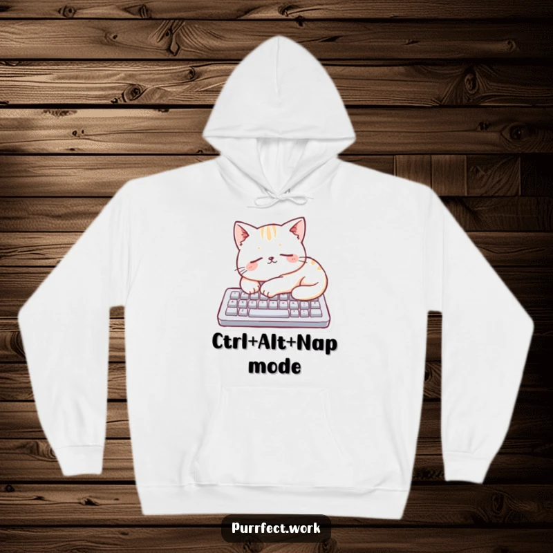 Funny cat sleeping soundly on a miniature keyboard, depicted on a cozy hoodie, promoting relaxation and humor.