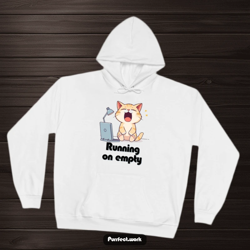 Funny cat hoodie showing a deeply sleepy cat yawning widely at its desk, perfect for cozy days.